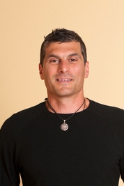 Headshot of Ben-Zion Eni